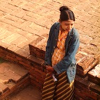 Pregnant guide in Bagan, wearing her make-up and cover for the sun.